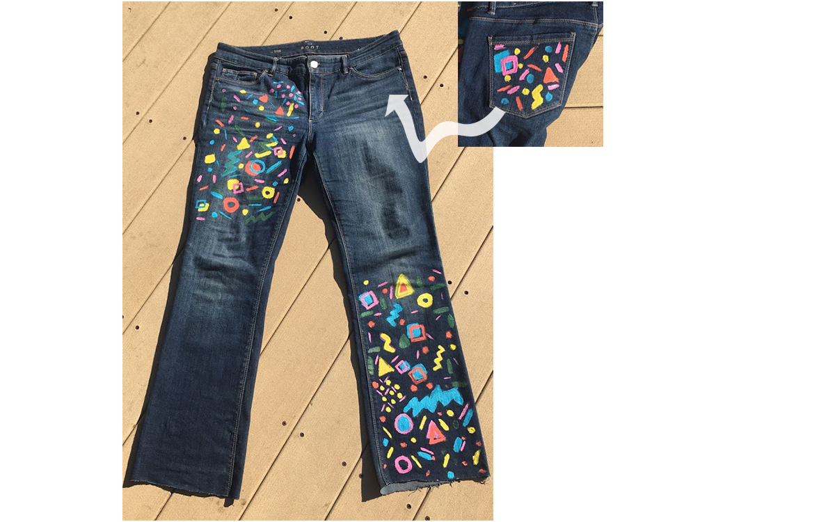 Upcycled pair of jeans painted with a geometric pattern