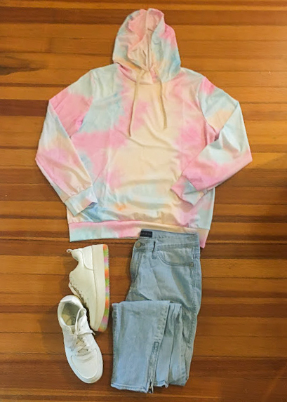 tie dye sweatshirt, jeans and white sneakers